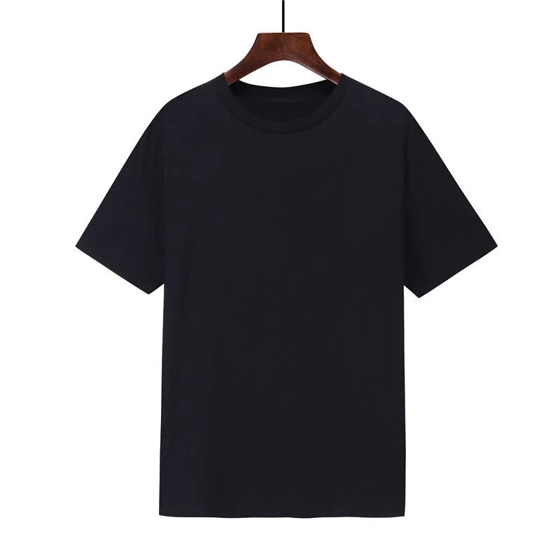 Man wearing a black loose-fit cotton T-shirt, short sleeves, crew neck.