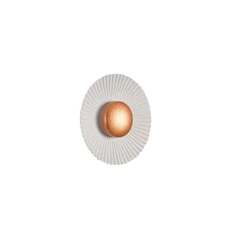 Round aluminium wall lamp mounted on a wall, showing a white and gold two-tone finish.