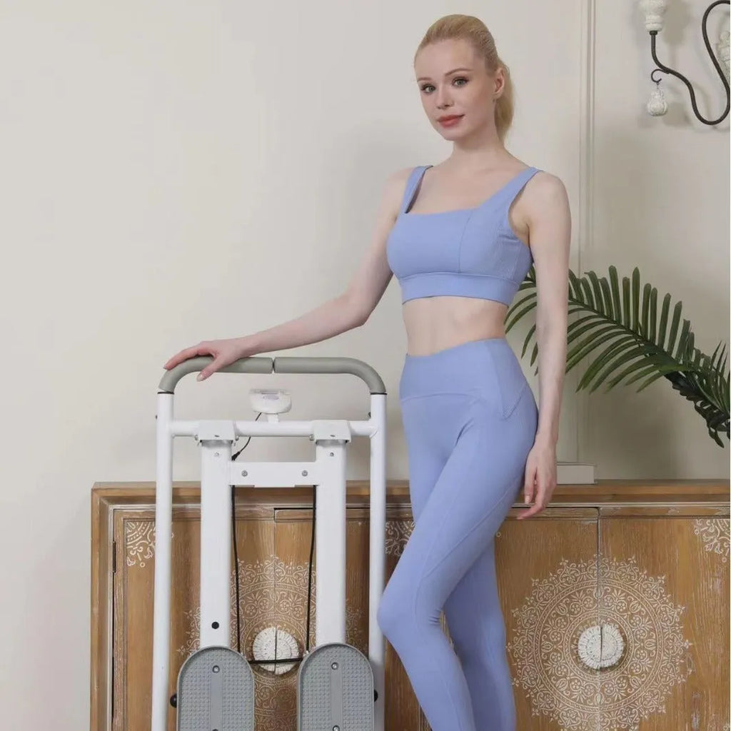 White folding home treadmill with a 1 horsepower motor shown in a domestic setting.