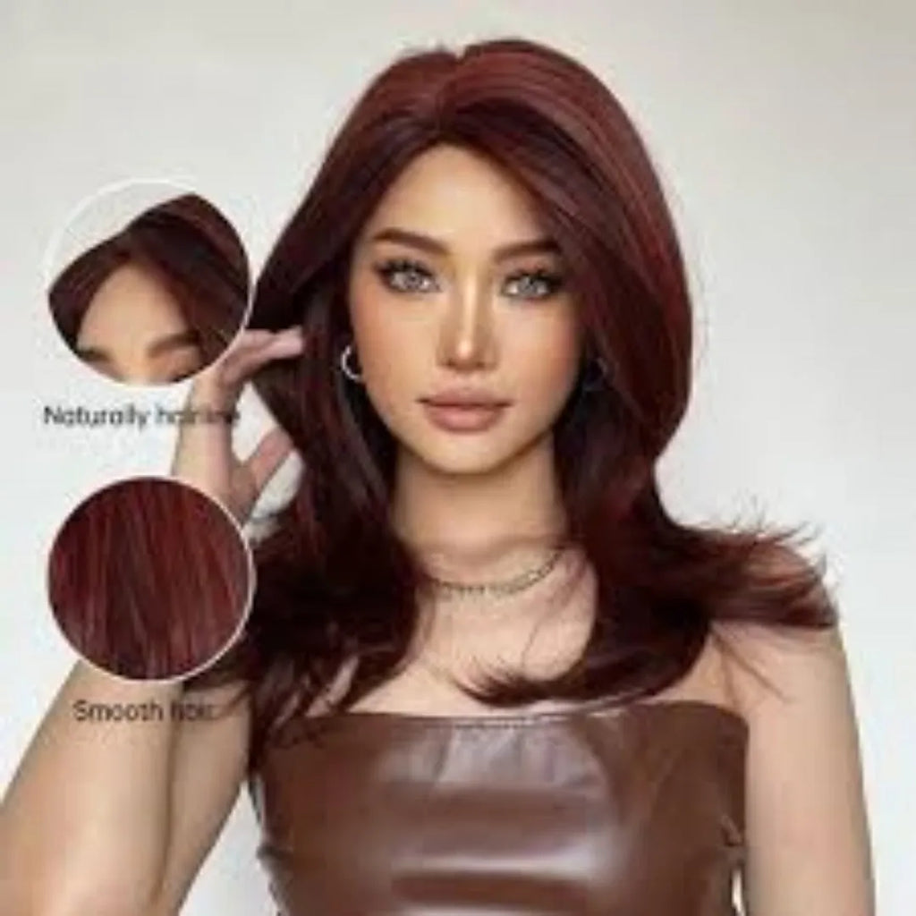 Mid-length curly full-head synthetic wig with long bangs in a platinum gradient colour.