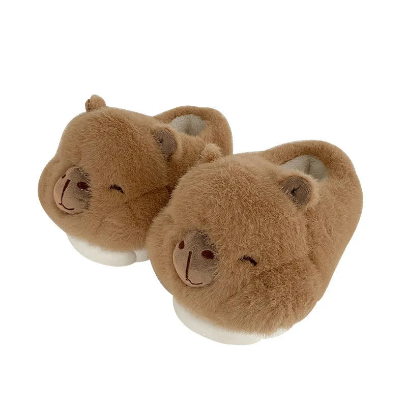 Light brown women's plush winter slippers with artificial wool lining and a PVC sole.