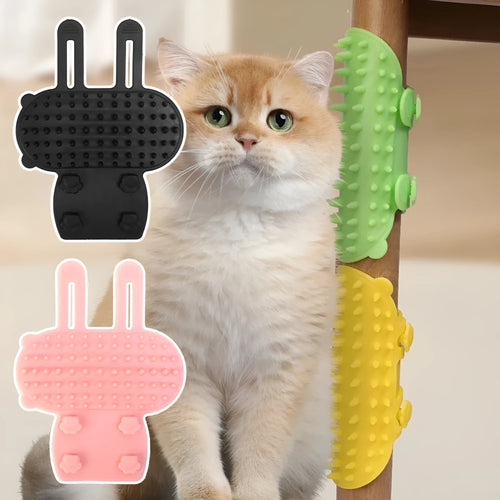 Silicone cat grooming comb with adjustable strap fastened to a table leg for self-cleaning