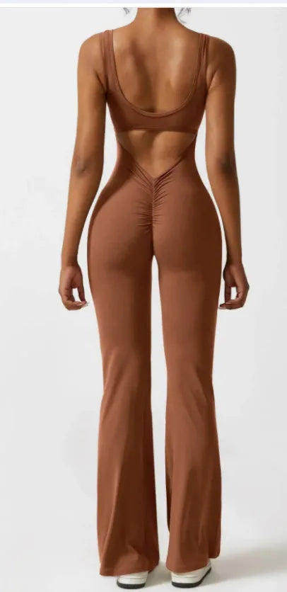 Women's black milk silk yoga bodysuit with seamless hollow design and mid-waist fit.