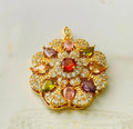 Close-up of a women's flower-shaped zircon pendant necklace in a gold electroplated finish on a model.