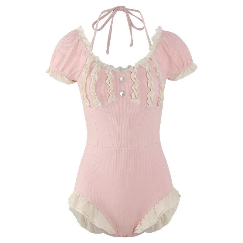 Pink women's one-piece swimsuit with Siamese design on a mannequin.