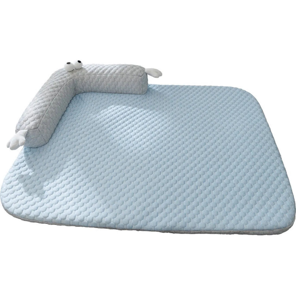 Blue pet bed cushion with cartoon monster face, showing non-slip base and folded size.