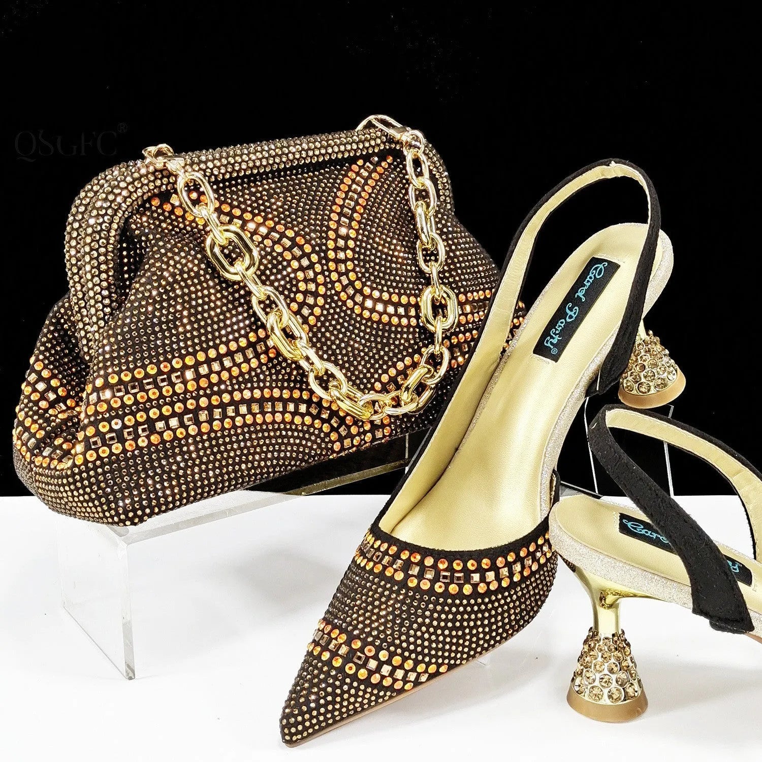 Women's pointed toe high heels with matching small bag, shown in a selected colour with a wine glass heel and rhinestone detail.