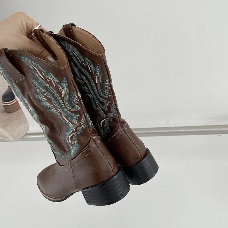 Brown women's mid-calf boots with embroidery detail, round toe, and low square heel.