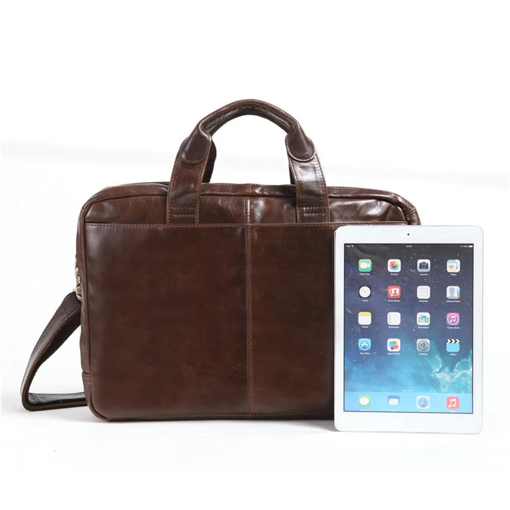 Brown leather men's business briefcase with 18 inch capacity and visible cowhide patterning