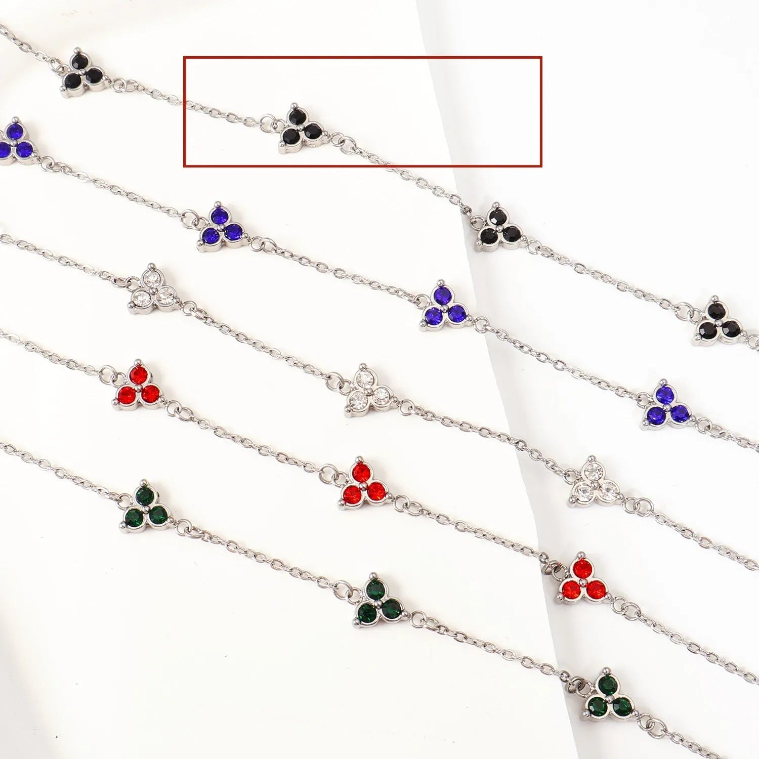 Geometric triangle women's bracelet in stainless steel with a choice of coloured centre stones on a gold or steel band.