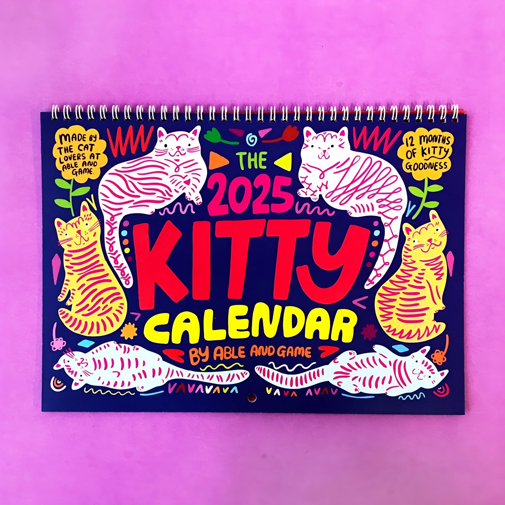 A portrait-format paper wall calendar featuring cat imagery, available for the 2024 or 2025 year.