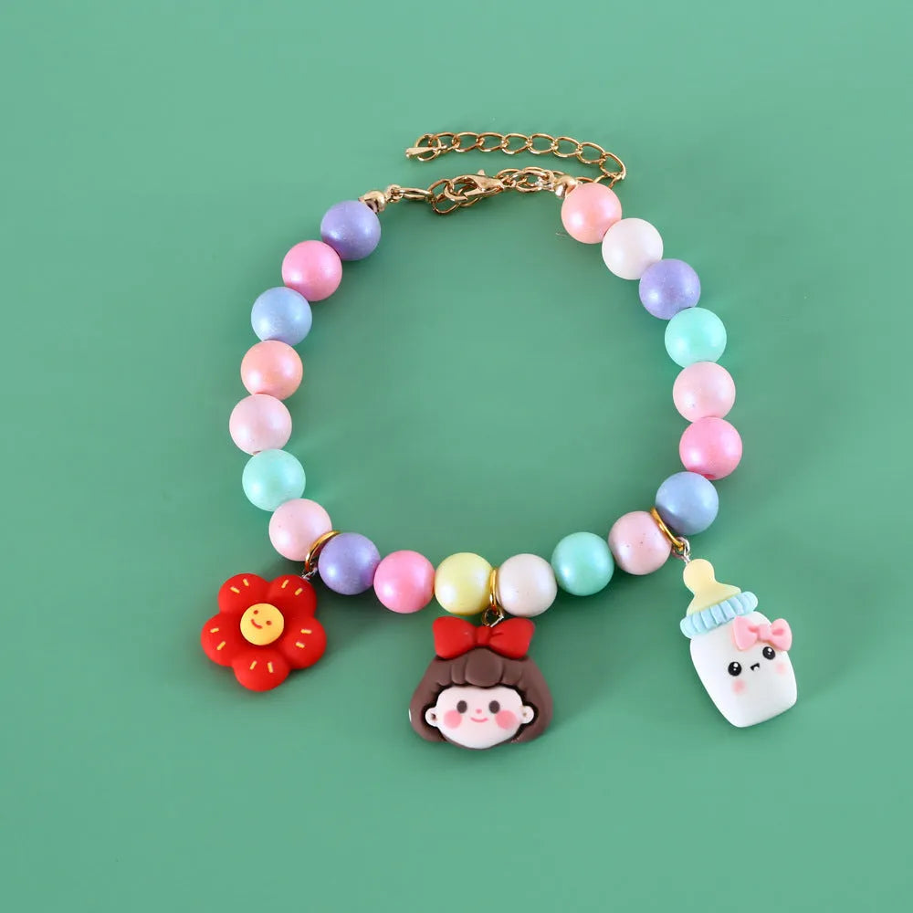 Pastel macaron charm pet collar with moon and rabbit designs on adjustable resin band for cats and dogs