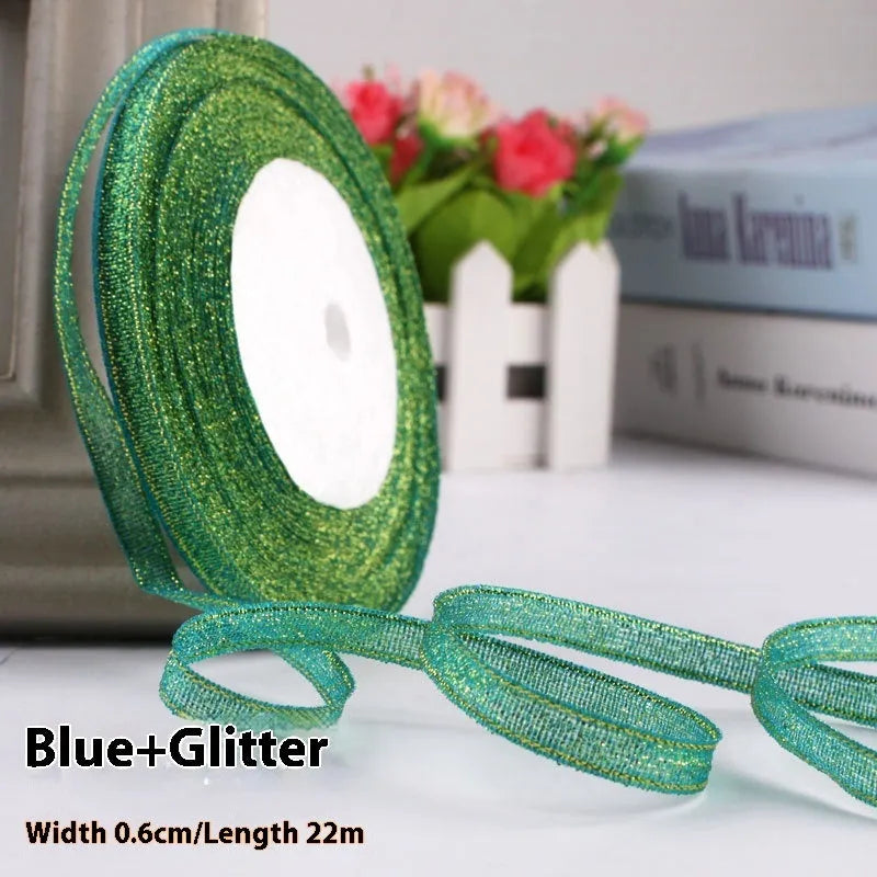 Roll of narrow 0.6cm wide polyester gift wrapping ribbon in assorted colours, showing 22 metre length.