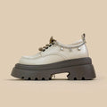 White platform Mary Jane shoes with chunky heel and round toe, front lace-up design
