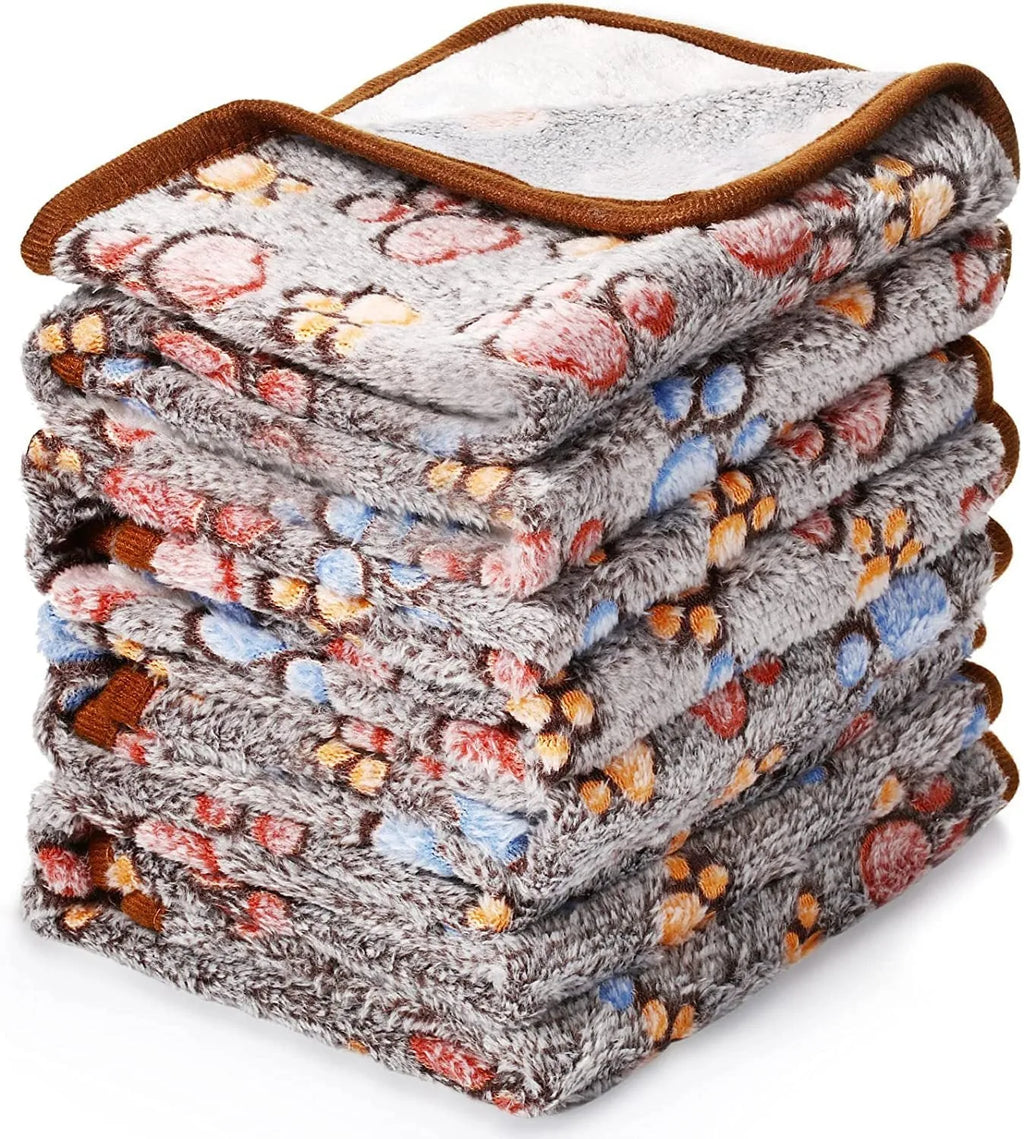 Coral fleece dog blanket with paw print design in multiple colour options and sizes
