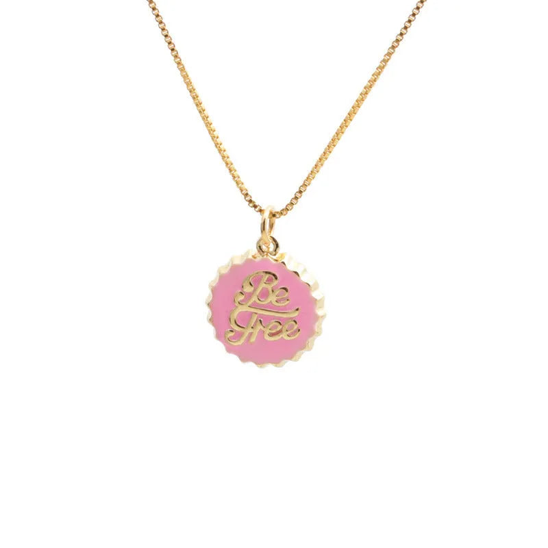 Copper bottle cap pendant necklace with gold plating on a box chain.