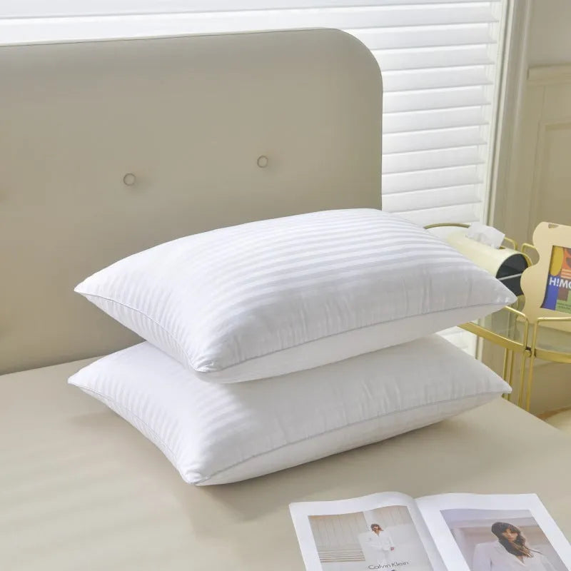 White cotton satin stripe pillow with feather cotton fill showing three size options