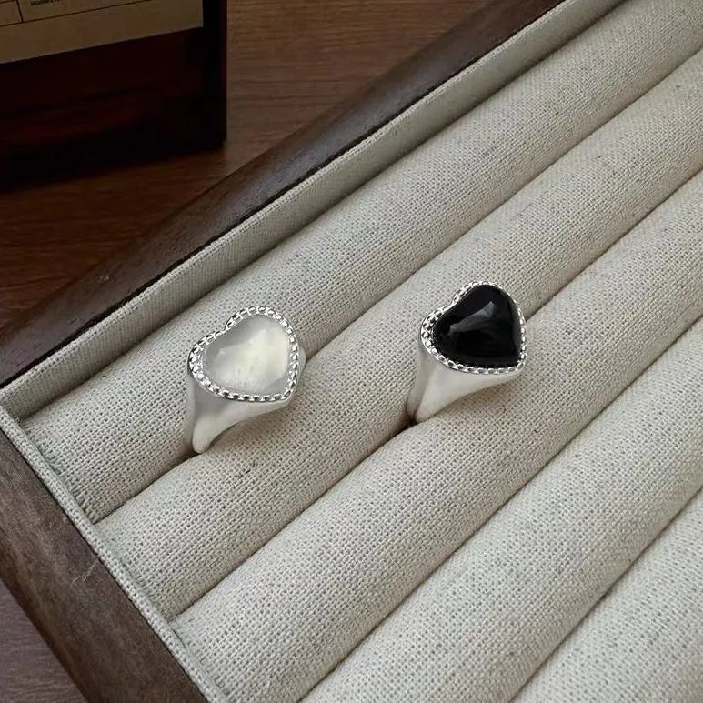 Adjustable open-mouth sterling silver ring with a black heart-shaped agate stone.