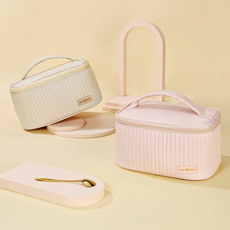 Open-top cake-shaped makeup bag in PU leather, shown in a solid colour from the pink, coffee, beige, blue, green, purple range.