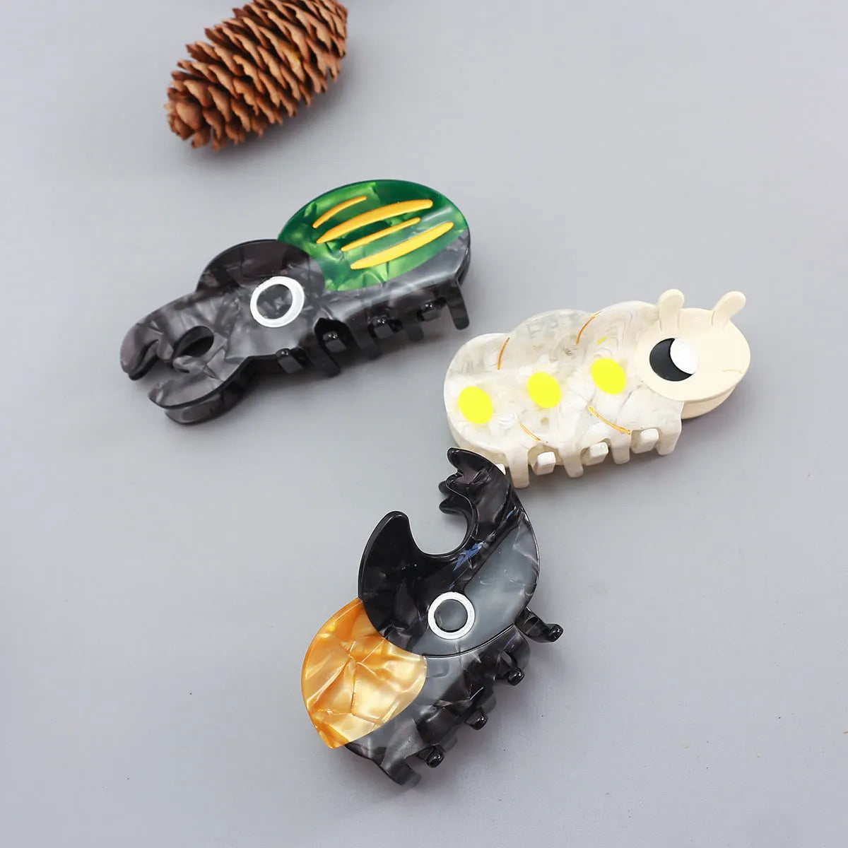 Handmade cellulose acetate Beetle Grip with cartoon caterpillar design