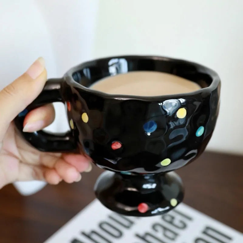Handmade ceramic mug with irregular shape in solid colour