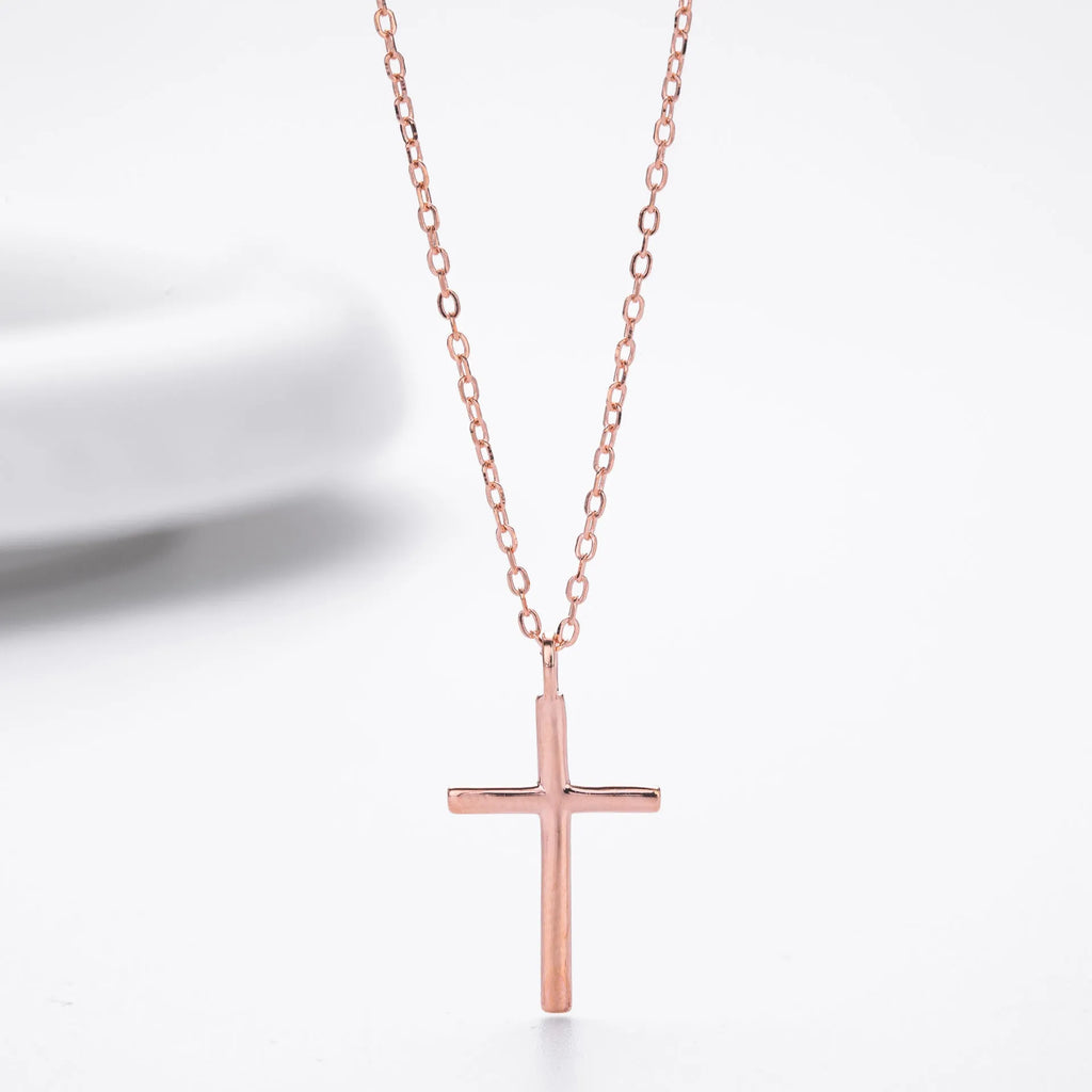 Sterling silver cross pendant necklace on an adjustable O-shaped chain, shown in gold plating.