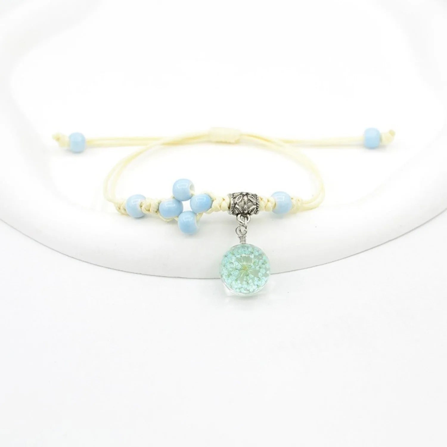 Glass dried flower bracelet with large 1.4 cm beads containing real preserved flowers in hand-woven lace design