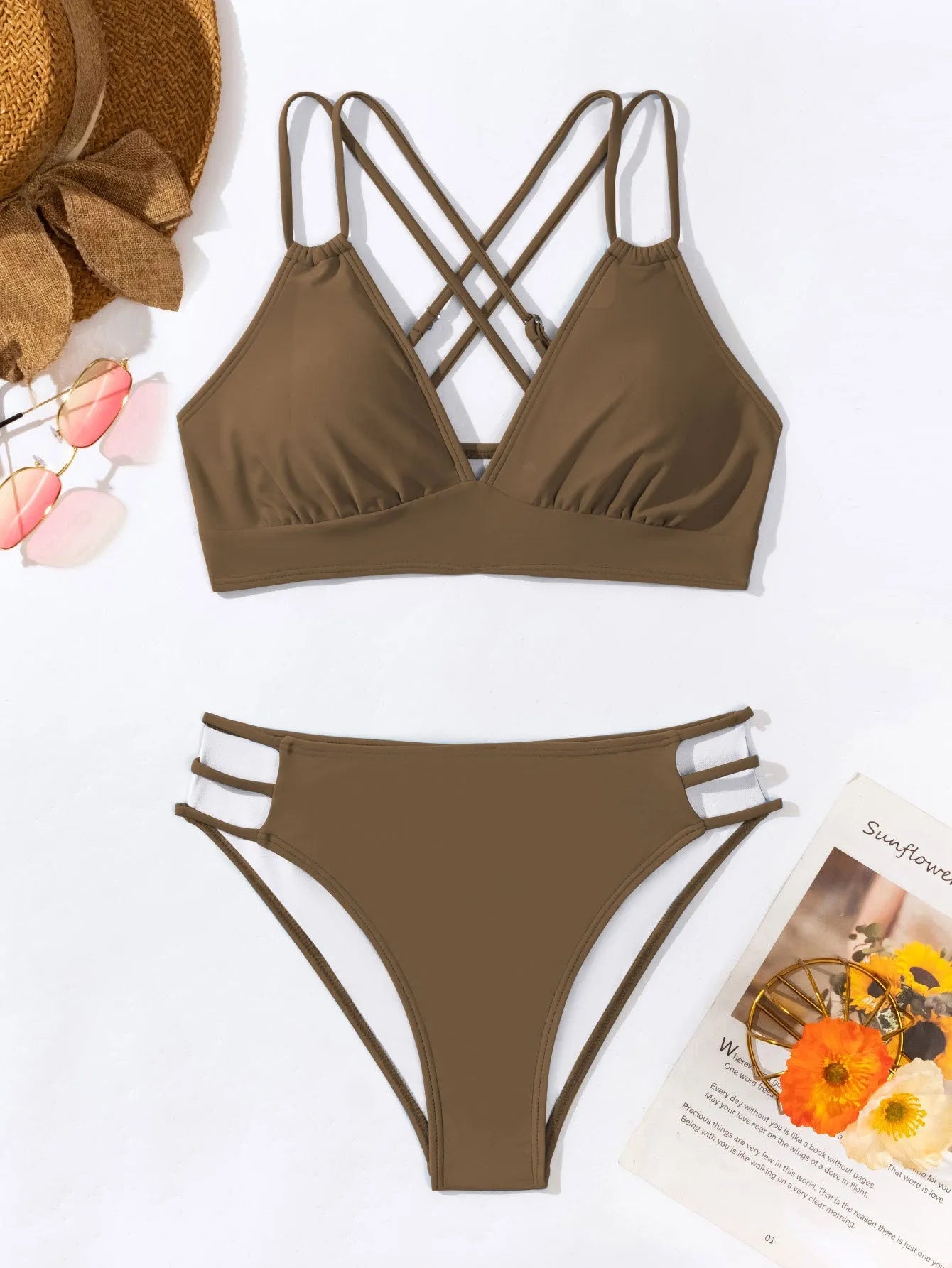Women's black halter neck bikini swimsuit with V-neck top and split shorts on mannequin