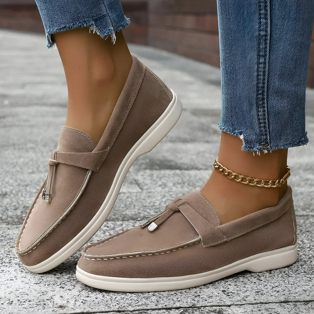 Casual canvas slip-on loafers with a round toe and platform heel, shown in a choice of colours.