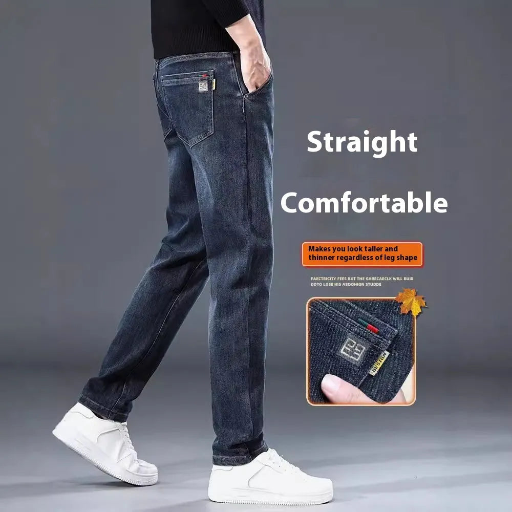 Man wearing slim straight blue grey casual trousers with a loose thin fit and zip fly.