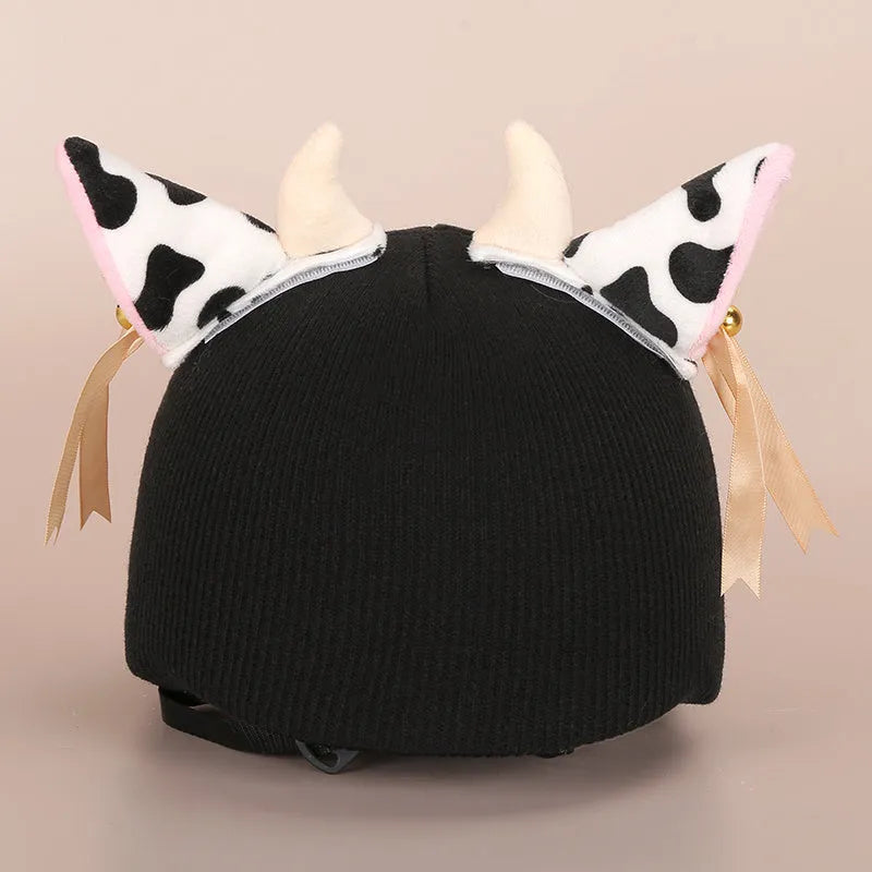 A plush fabric helmet cover with cartoon character ears, shown in size M for bicycle or motorbike use.