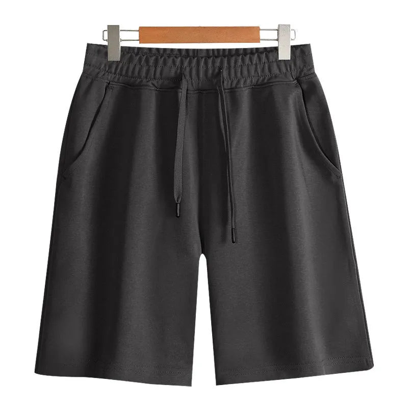 Cotton micro-elastic sports shorts in straight cut fifth length design on hanger
