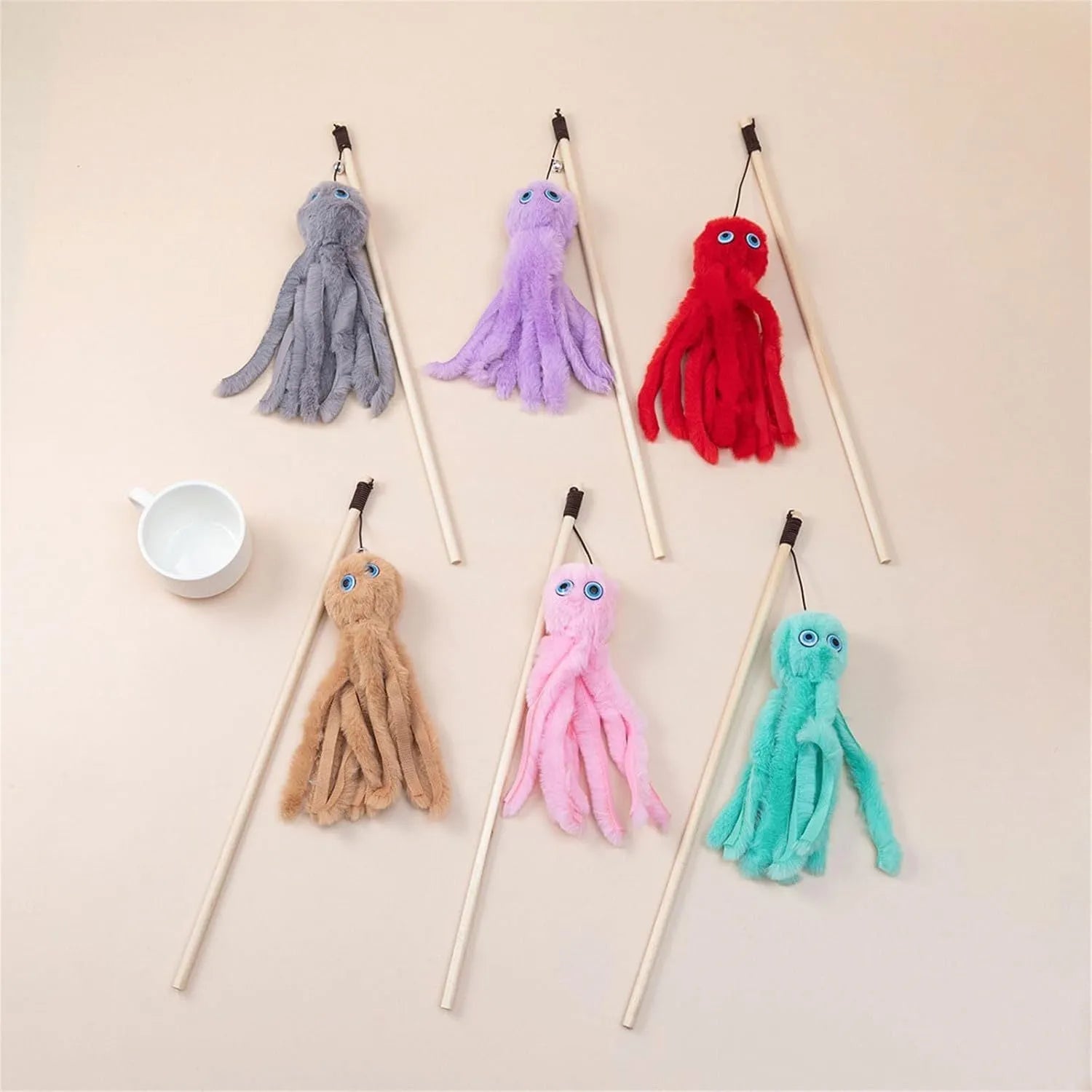 Octopus-themed cat toy with long stick handle and moving eyes for indoor play with kittens