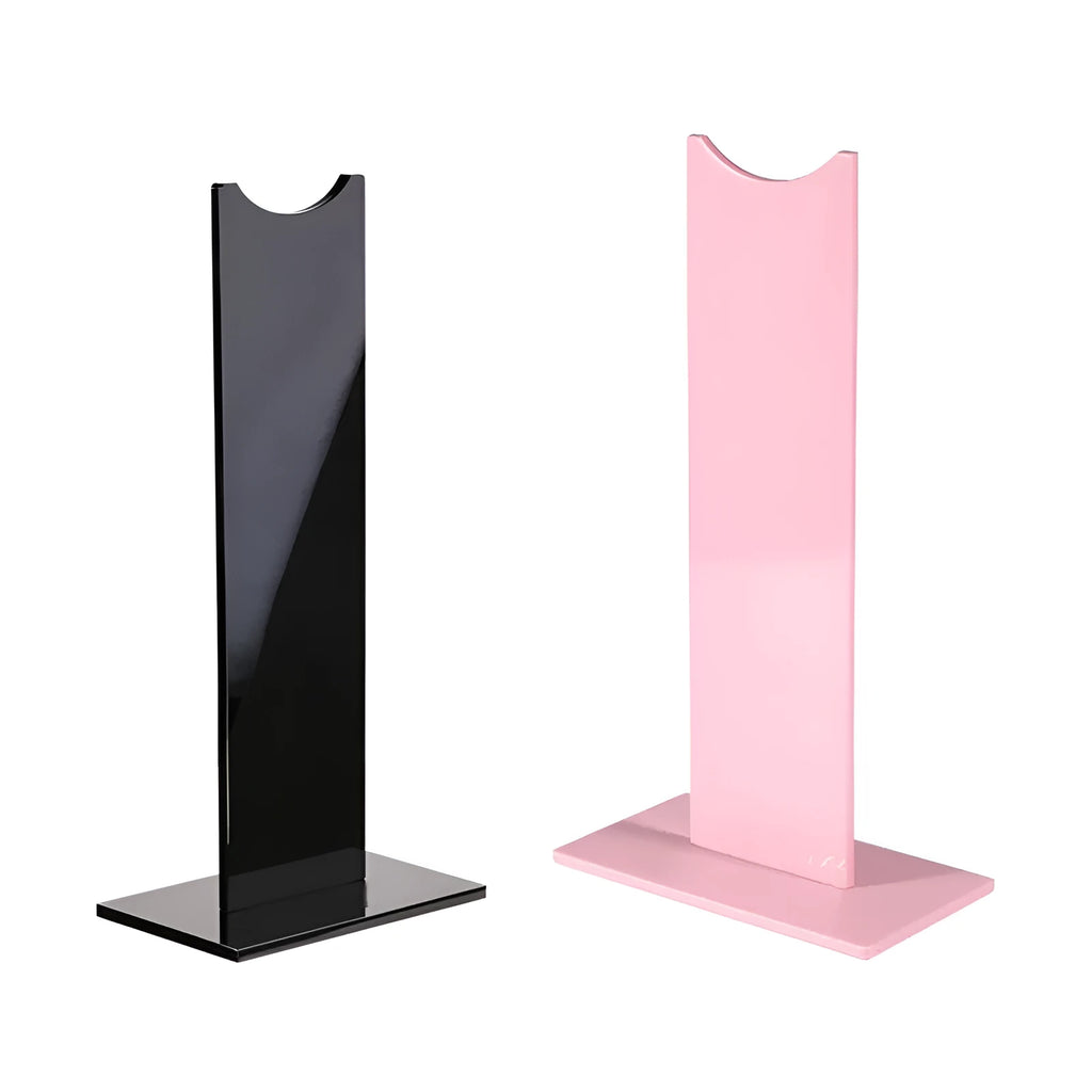 Pink and black detachable gaming headset stand on a desk with a non-slip silicone base.