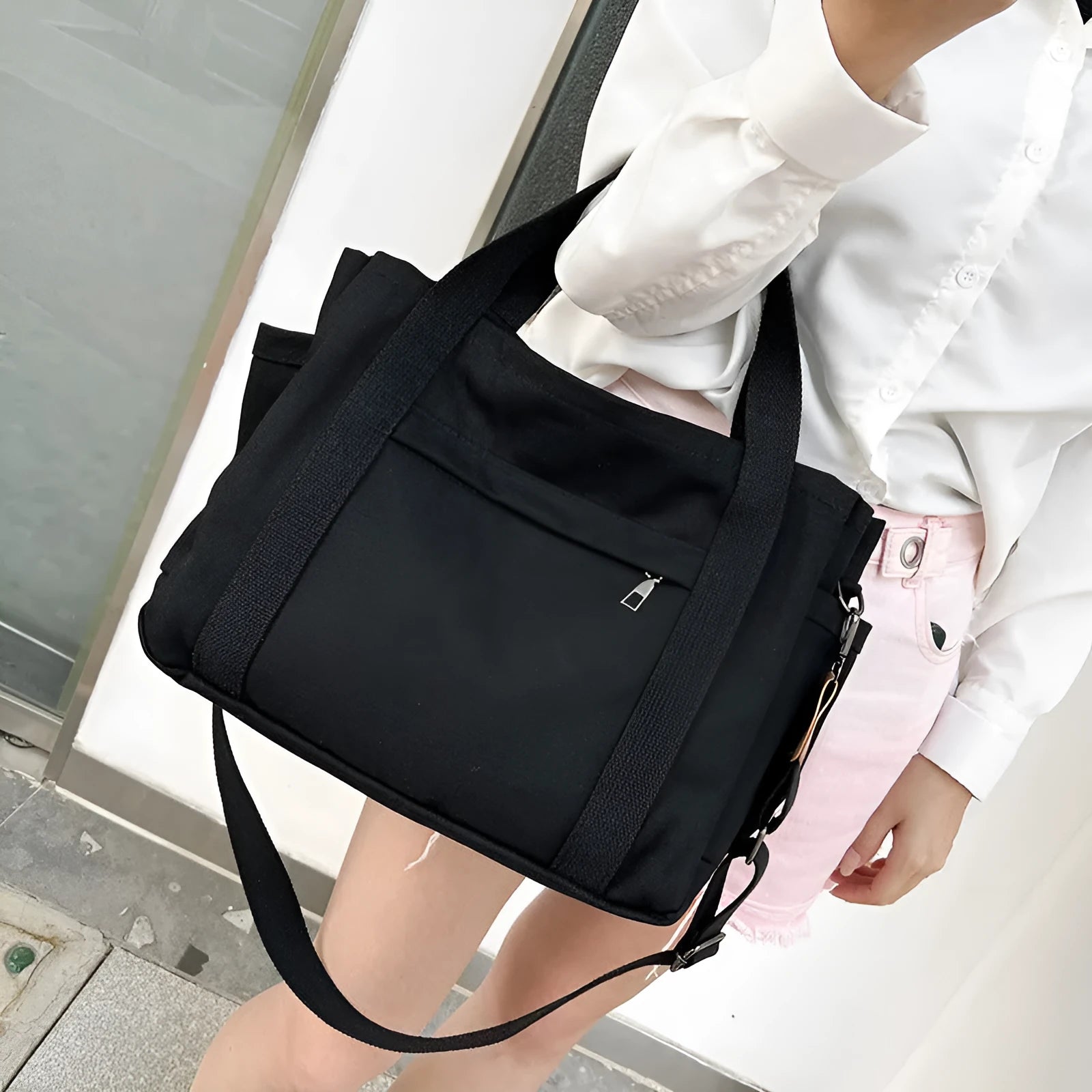 Large khaki canvas tote bag for women with open top showing internal laptop and camera pockets