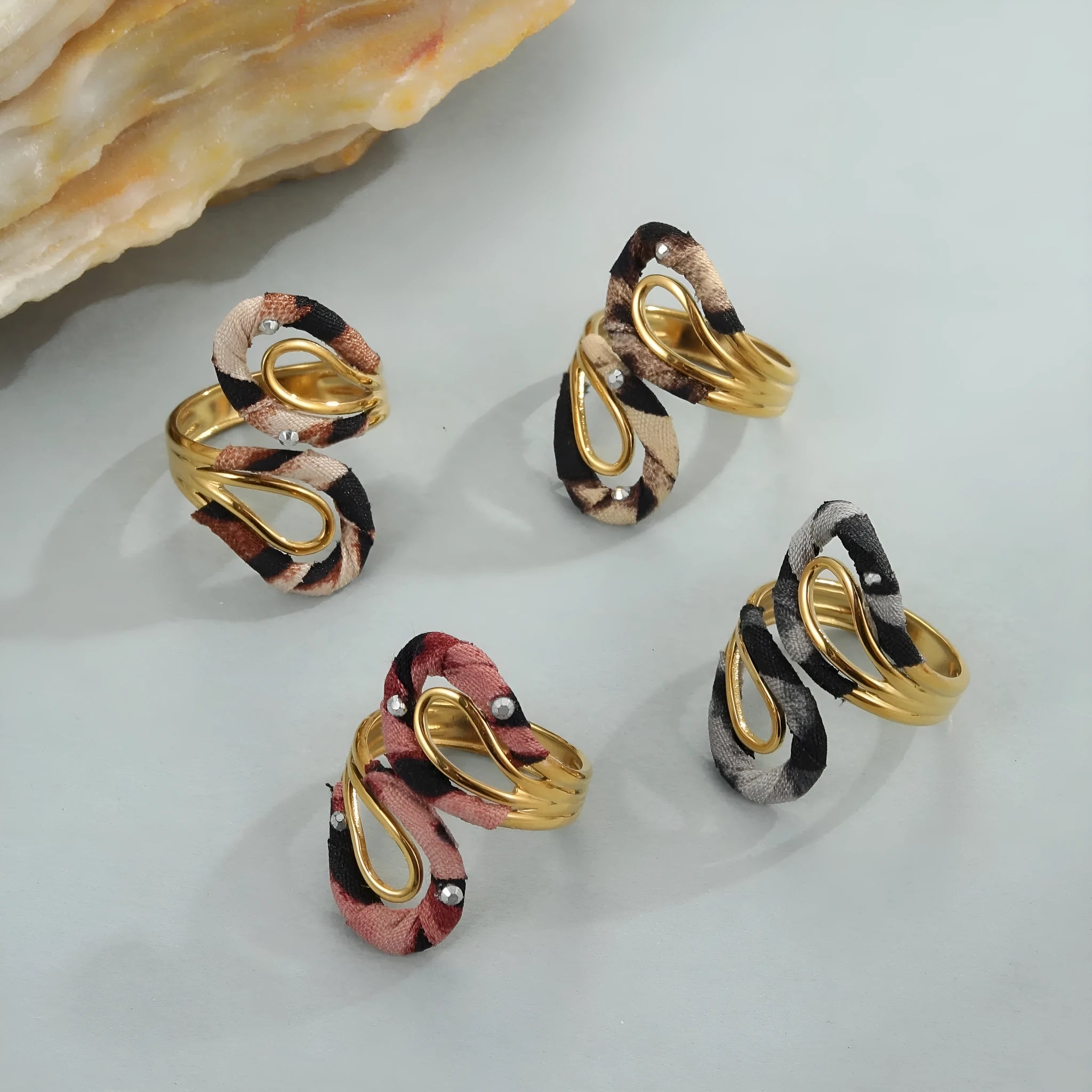 Leopard print geometric open mouth adjustable ring in stainless steel, showing heart shape on finger.