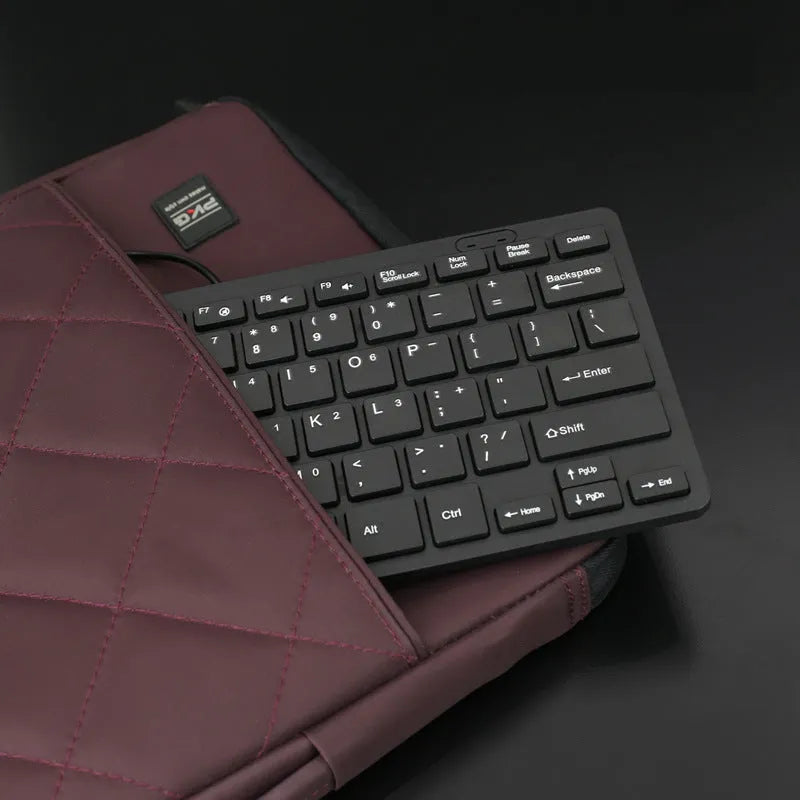 USB wired mini keyboard in black with compact 280mm width and noiseless keys for laptop use