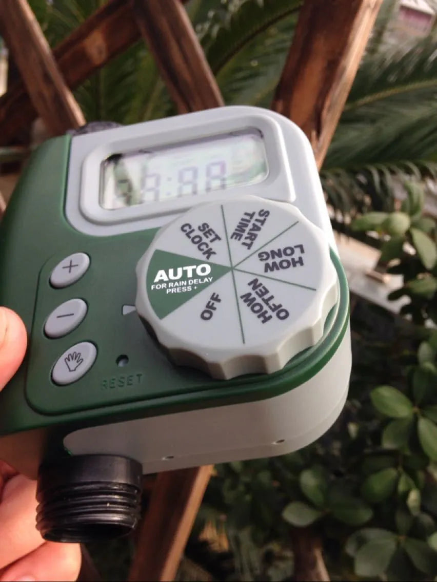 Green digital automatic hose faucet timer with large display and copper connector for garden irrigation