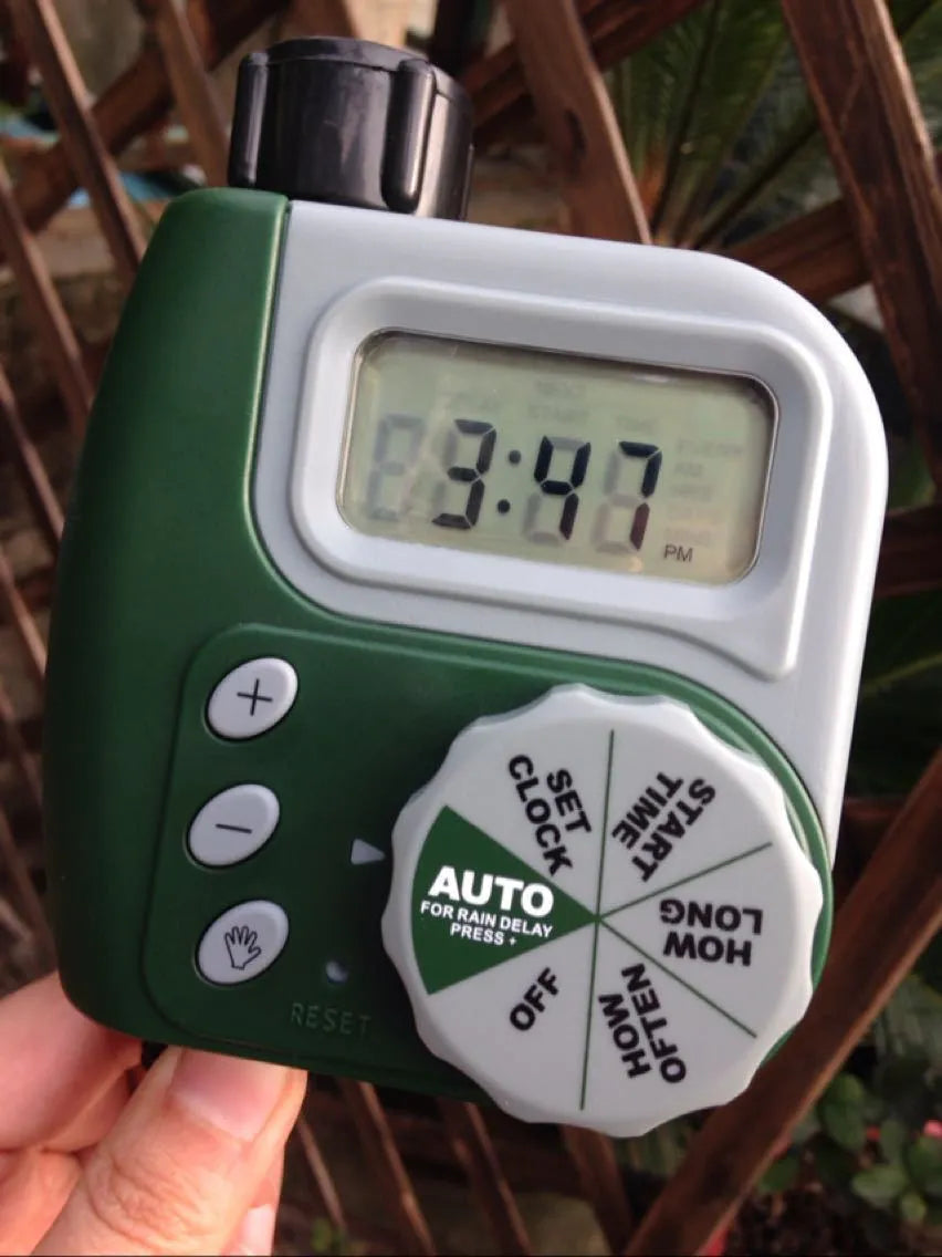 Green digital automatic hose faucet timer with large display and copper connector for garden irrigation
