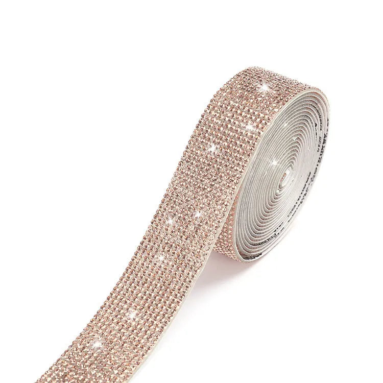 Self-adhesive glass water drill strip on a one-yard reel for shoe and clothing decoration.