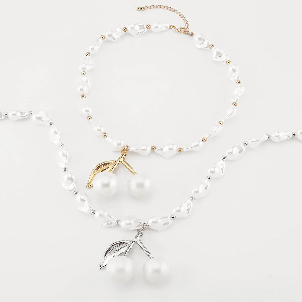 Gold geometric cherry fruit pendant on imitation pearl chain necklace for women