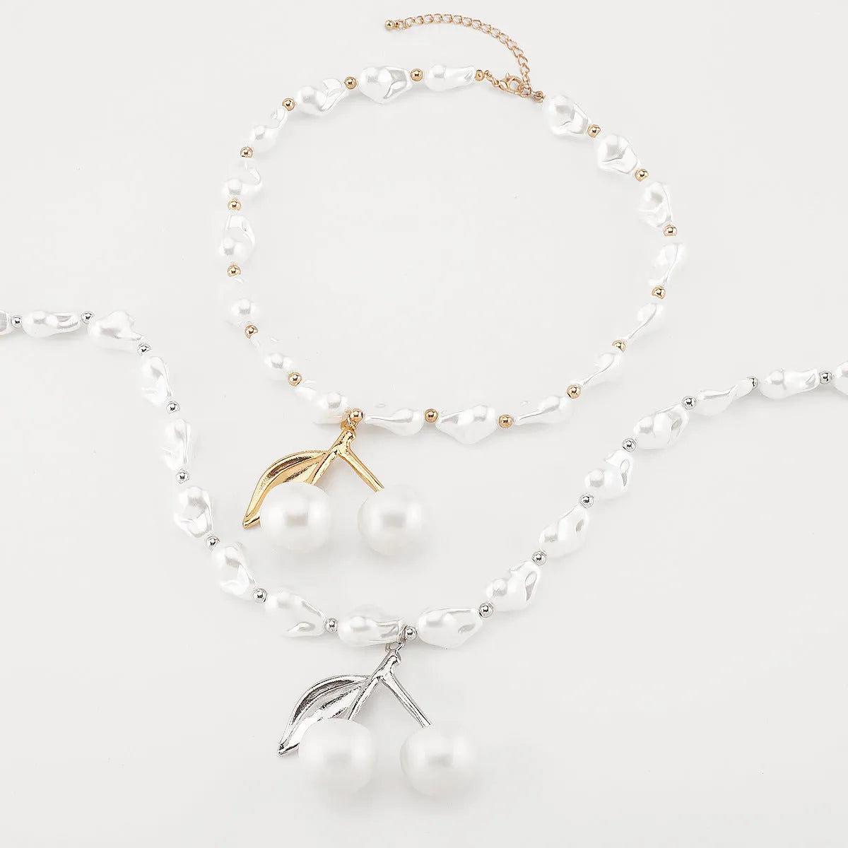 Gold geometric cherry fruit pendant on imitation pearl chain necklace for women