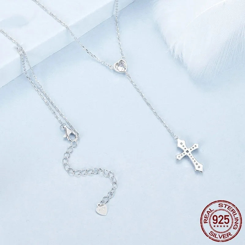 Silver love cross pendant necklace with V-neck chain on woman