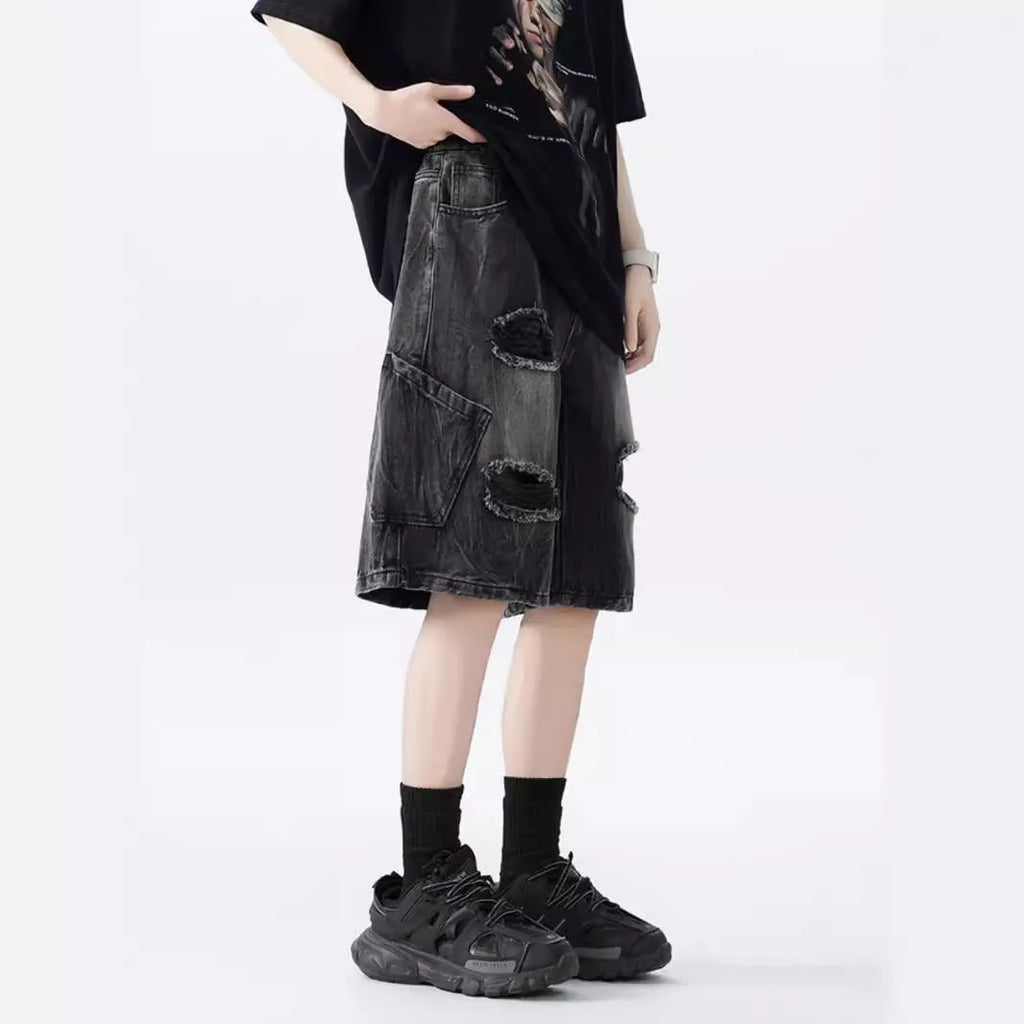 Washed denim shorts with ripped detailing in loose retro fit, black and blue colour options