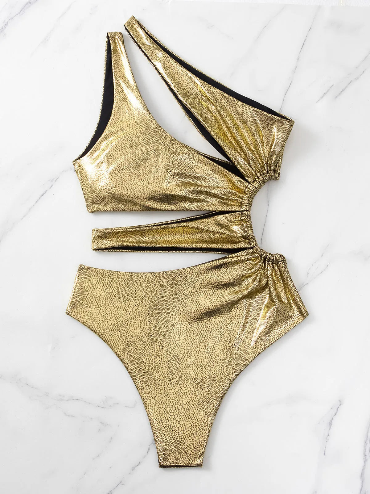 Women's gold backless one-piece swimsuit on hanger showing spandex material and European American style