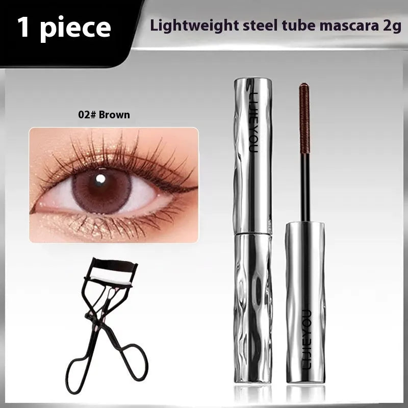 Waterproof steel tube mascara in black and brown shades shown with an eyelash curler.