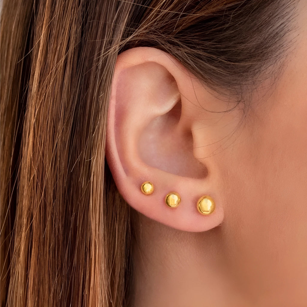 Stainless steel ball stud earrings with geometric round design in gold or silver electroplated finishes
