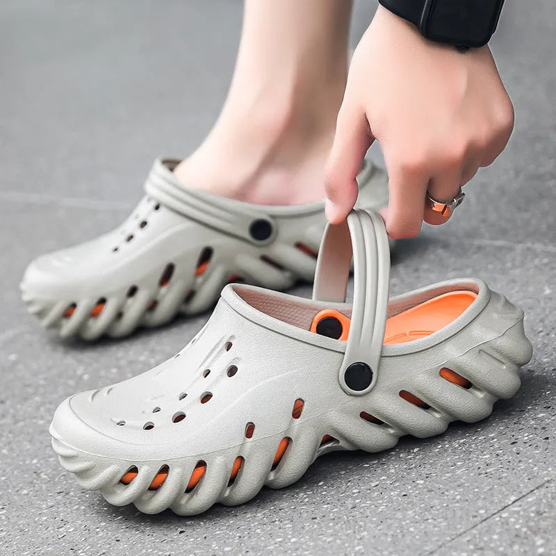 Men's beige hollow-out EVA slipper sandals with non-slip sole on a white background.