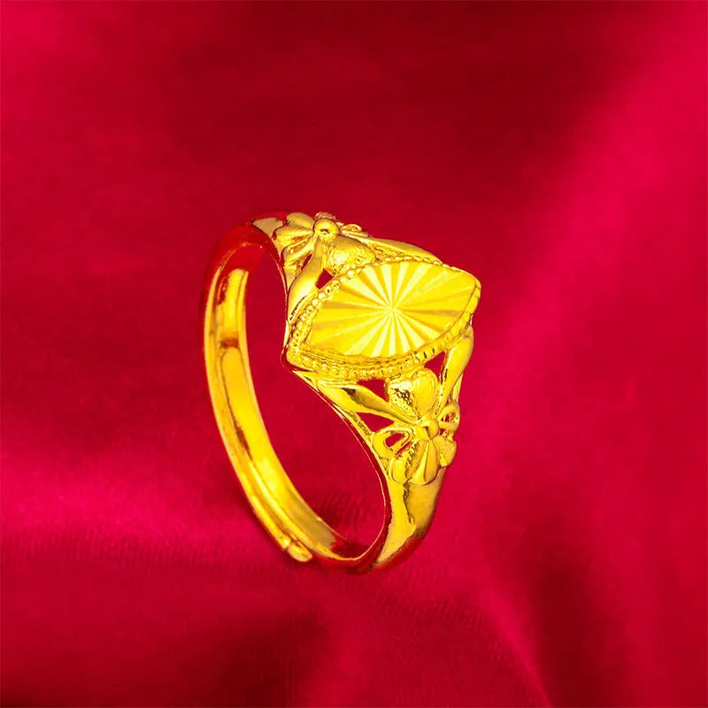 Gold electroplated brass flower ring with open geometric design and textured alluvial pattern
