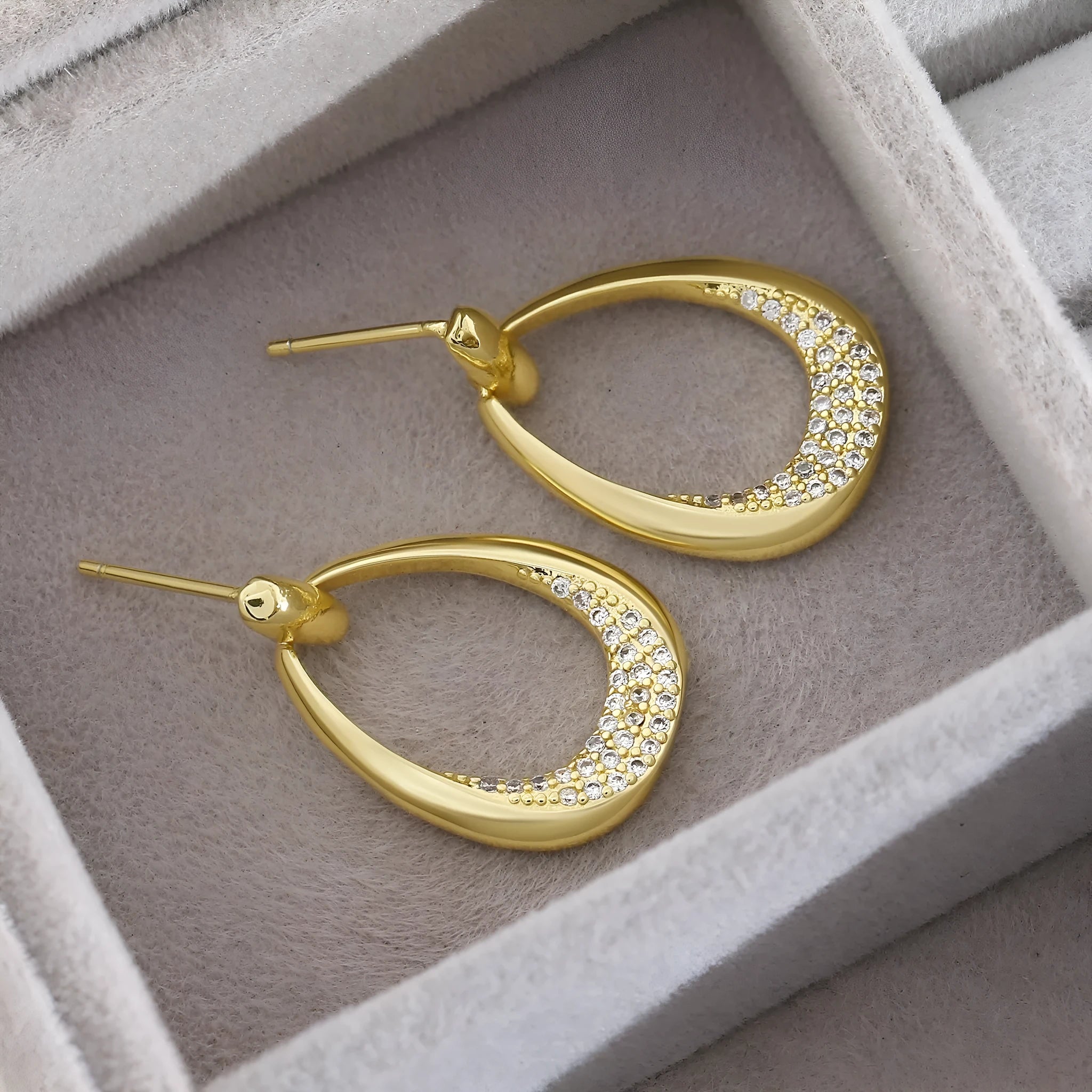 Yellow gold geometric drop earrings for women with a simple ring-style design.
